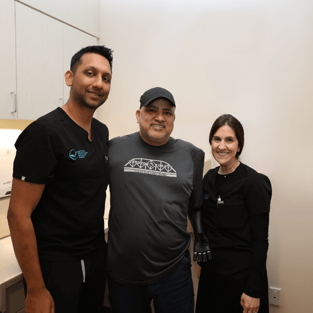 ARMS specialists celebrating successful prosthetic fitting, enhancing patient mobility and confidence with cutting-edge care.